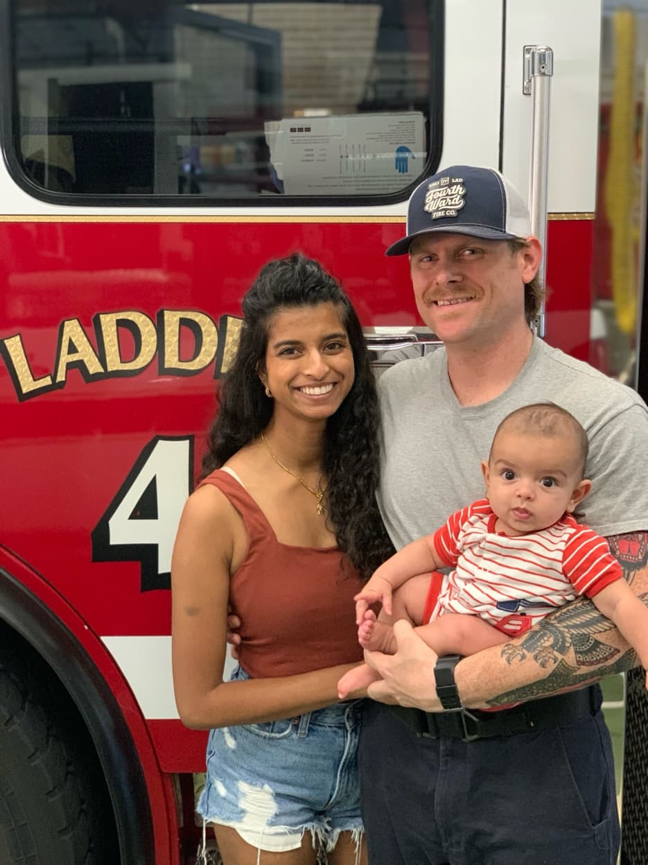 Jacob Shope with his wife Christine and their son at the fire station